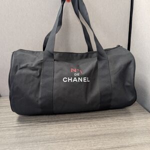 CHANEL Black Travel Bag with Red Logo